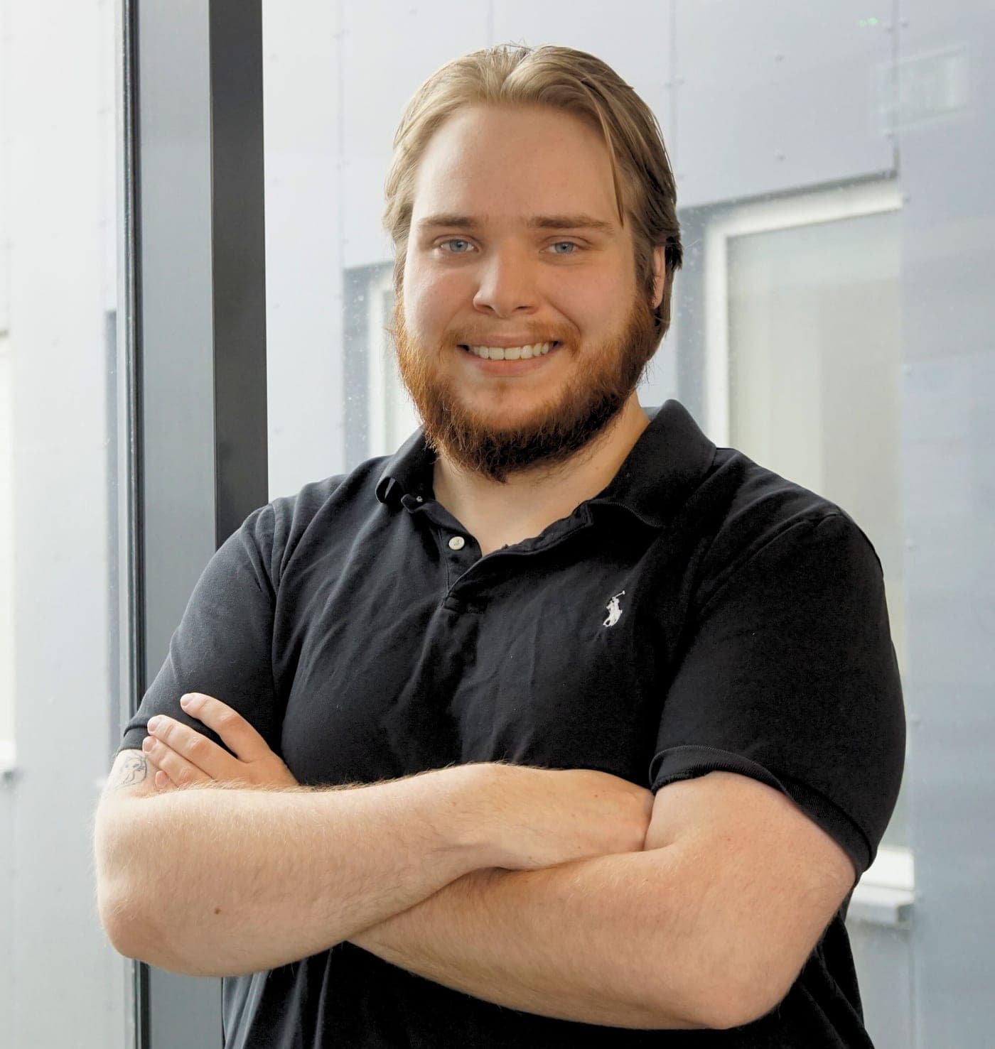 Andri Pétur Hafþórsson, arms crossed, smiling
